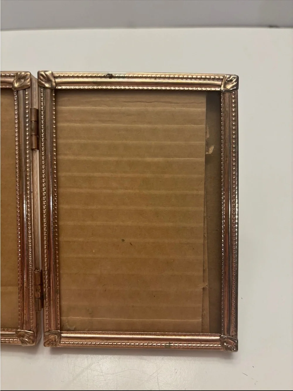 Vintage ornate golden color tri fold picture frame